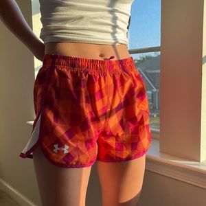 Pink/Orange Under Armour Running Shorts.